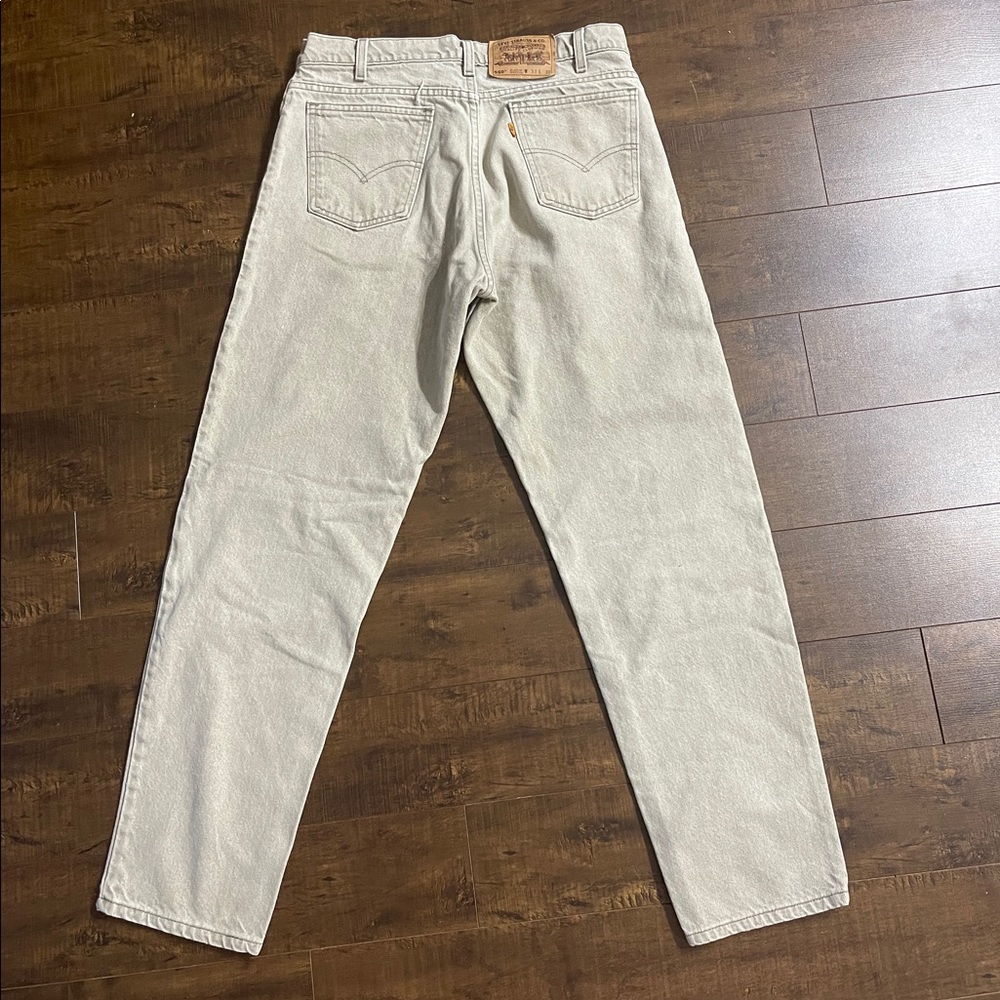 Vintage light sage green Levi’s 550 — Relaxed tapered fit. Orange tab